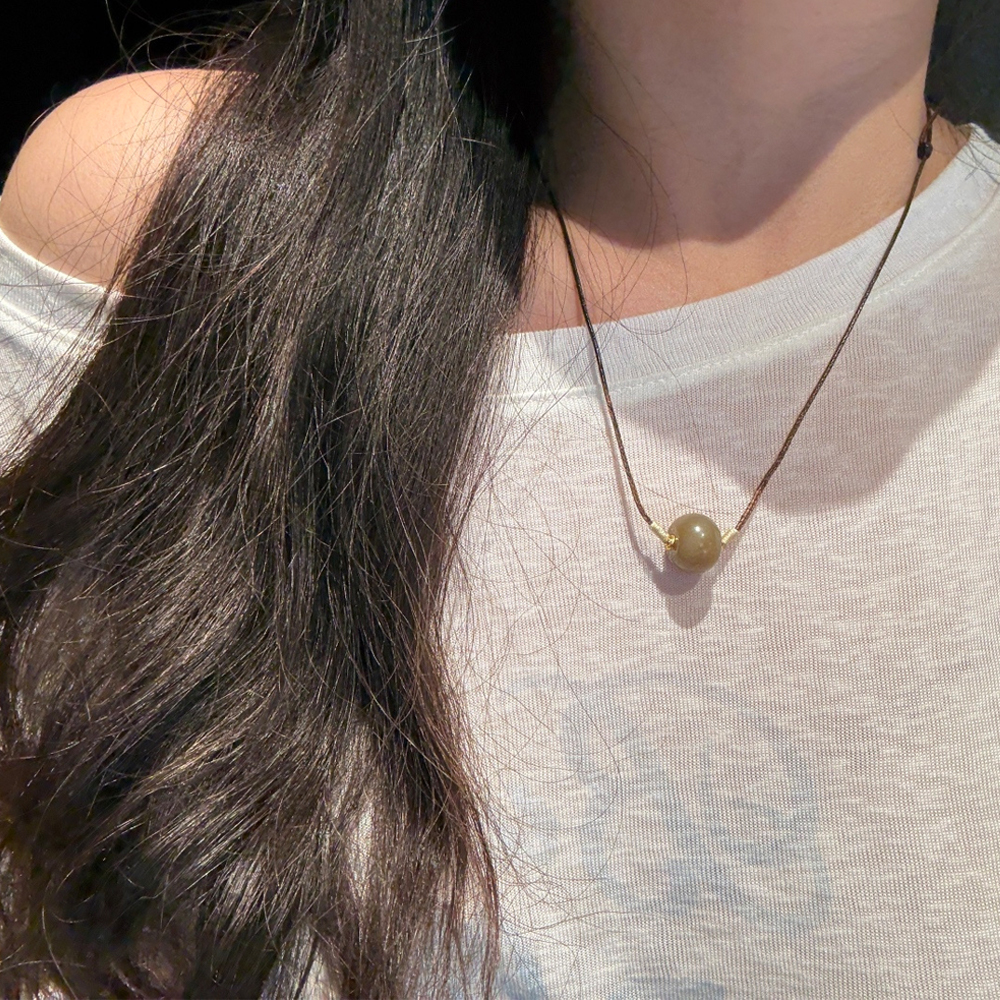 Caramel-hued Hetian jade *Ping'an Kou* (safety buckle) pendant